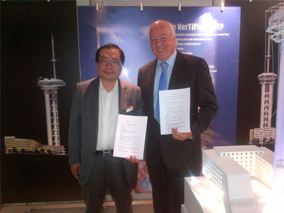 Brian Pettifer and Mr Xiao holding signed MOUs for the proposed international pilgrimage and tourism development at Lumbini, Nepal – the birthplace of the Lord Buddha